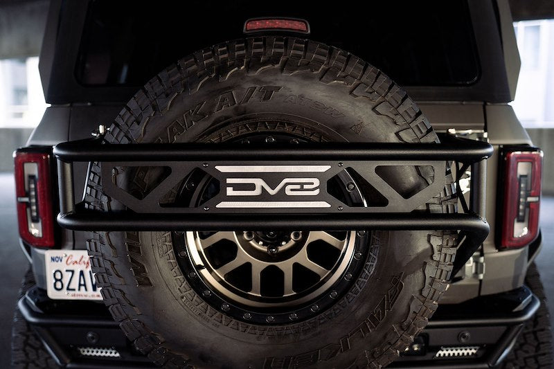 DV8 Offroad Bronco | Spare Tire Guard & Accessory Mount (2021-2025)